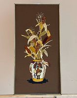 Full view of framed embroidery showing entire design