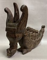 Left front view showing dragon head prow and side details