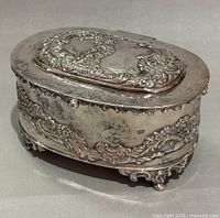 Closed view showing ornate top and overall condition