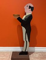 Front right view of wooden butler holding tray