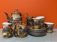 Full tea set displayed showing teapot, sugar, creamer, cups and saucers