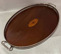 Full view of wooden tray showing marquetry and silver gallery