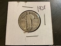 Obverse of Standing Liberty quarter in holder