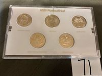 Front of display showing five 2020 quarters with site names