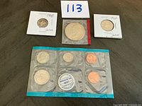 Overall lot view – silver dime, silver quarter, Kennedy half, uncirculated mint pack