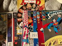 Stack of bagged DC Superman comics and Mad Magazine