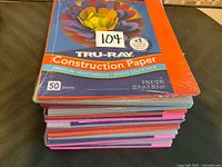 Stack of sealed Tru-Ray construction paper packs showing quantity