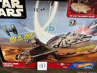 Front of Hot Wheels Star Wars Escape From Jakku playset box showing Millennium Falcon and features