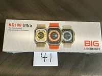 Front of sealed KD100 Ultra smartwatch box showing product images and branding