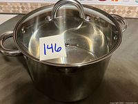 Front view of stainless steel stock pot with lid