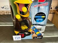 Front of boxed Hungry Duck game showing duck target, launcher and balls