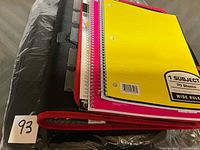 Binder with notebooks stacked inside