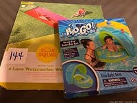 Front of both boxed items showing product images and branding