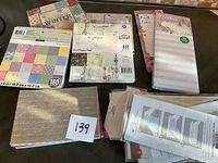 Group of all pads, notepads and card kits on table