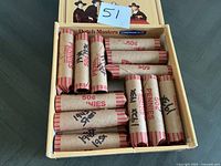 Box containing 24 wrapped penny rolls