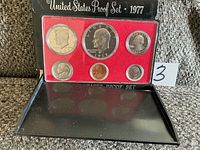 Complete 1977 proof set in holder and outer sleeve