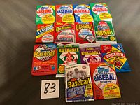 All 14 unopened sports card packs laid out