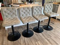 Group shot of all four swivel stools lined up at counter