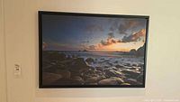 Front view of framed sunset ocean canvas print