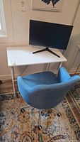 Desk, chair and monitor together