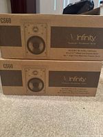 Two stacked boxes labeled Infinity CS60 showing front view