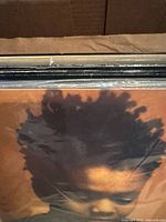 Stack of LP records, top showing Tracy Chapman cover