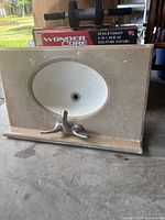 Front view showing full vanity top, sink, faucet, backsplash