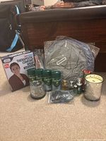 Group shot showing comfort wrap box, grey wrap, Mitchum sticks, mini colognes, candles, mouthpiece case