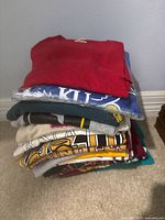 Stack of folded assorted vintage t-shirts
