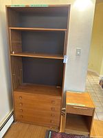 Full view of bookcase with drawers and matching side table