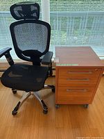 Chair and file cabinet side by side