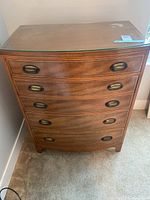 Full front view of dresser showing four drawers and hardware