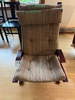 Front view of Poäng chair showing full cushion and frame
