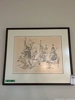 Framed, matted lithograph on wall