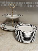 Two-tier stand and stacked bread plates