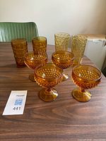 Group shot of all eight amber glasses on table