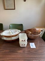 All seven Pyrex pieces stacked on table