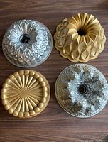 All four pans showing finishes and designs