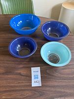 All four blue Pyrex mixing bowls displayed on table