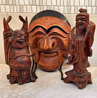 All three carved wooden items grouped together