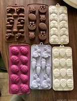 Six silicone Easter baking molds in assorted colours and designs
