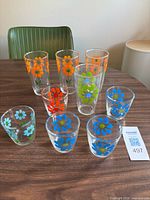 Nine Hazel Atlas daisy glasses on table