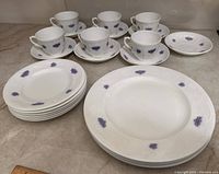 Group view of plates, cups and saucers on countertop