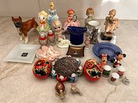 Overall lot showing assorted figurines, dishes, eggs and thimbles