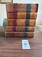 Stack of five volumes showing spines and volume numbers