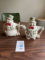 Front view of two Lenox snowman pieces showing design, colors and relative size