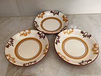 Three Stangl Paisley Dura-Fired coupe soup bowls, top view