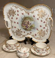 Overall view: Sevres tray, two JP cream soup sets, Haviland sugar bowl