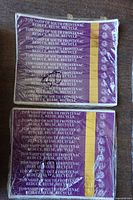 Two shrink-wrapped stacks of purple Township of South Frontenac garbage tags