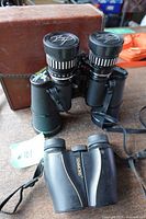 Tasco 106Z binoculars with caps, Simmons pocket binoculars, brown case visible